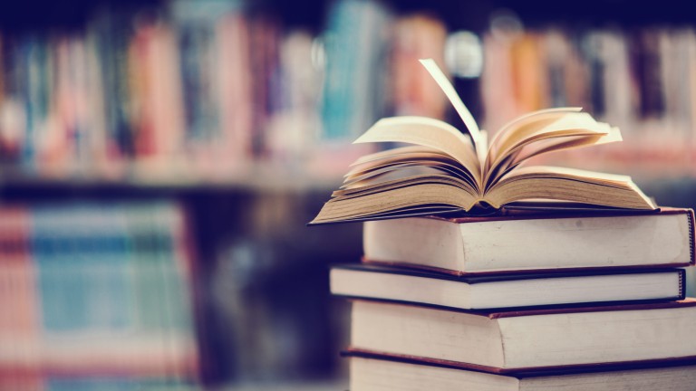 Book in library with open textbook,education learning concept